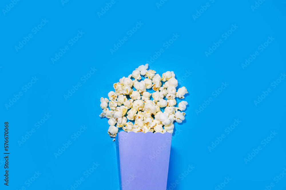 Popcorn flat-lay on blue background