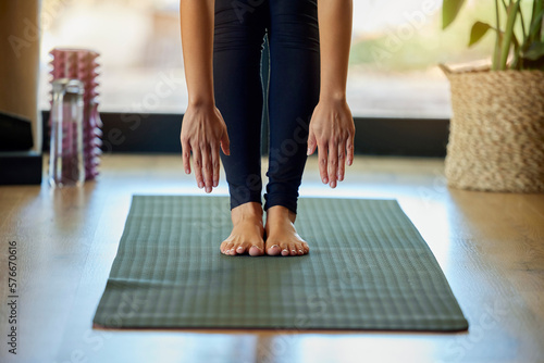 Obraz na plátně Hands, feet and yoga with a woman in her home for a mental health, fitness or wellness workout