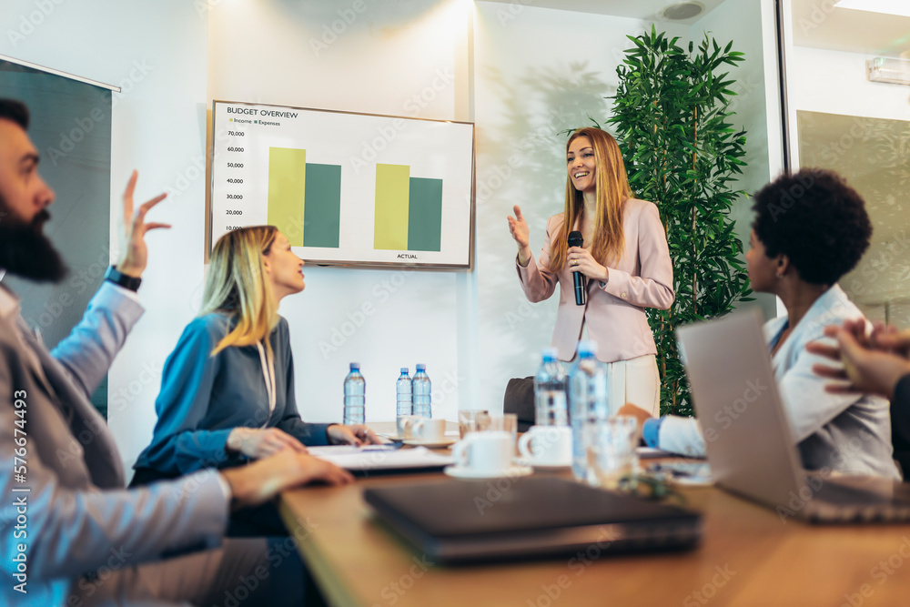 Business people having a meeting or presentation and seminar in the office. Portrait of a young business woman leader Business people having a meeting or presentation and seminar in the office. Portrait of a young business woman leader