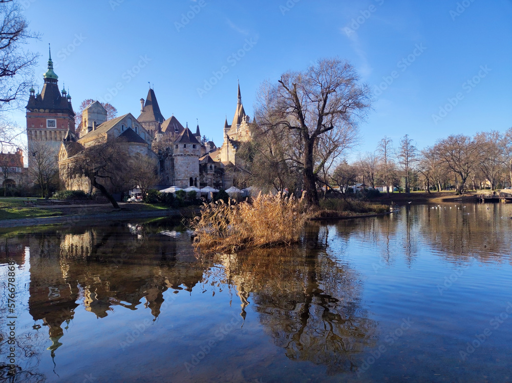 Museum of Agriculture in Budapest reflected in the lake in the park in bright winter day Museum of Agriculture in Budapest reflected in the lake in the park in bright winter day