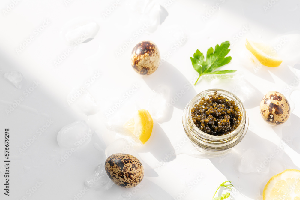 Appetizers of natural sturgeon black caviar, lemon and parsley