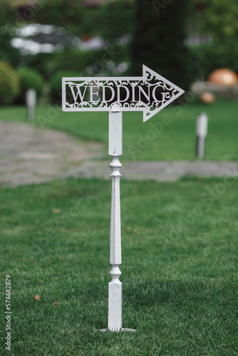 Wallpaper Mural Wedding decorations. plate with the inscription wedding. Wedding on a green background. Wedding decorations Torontodigital.ca