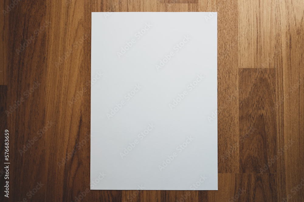 White paper on wooden background, Selective focus. White paper on wooden background, Selective focus.