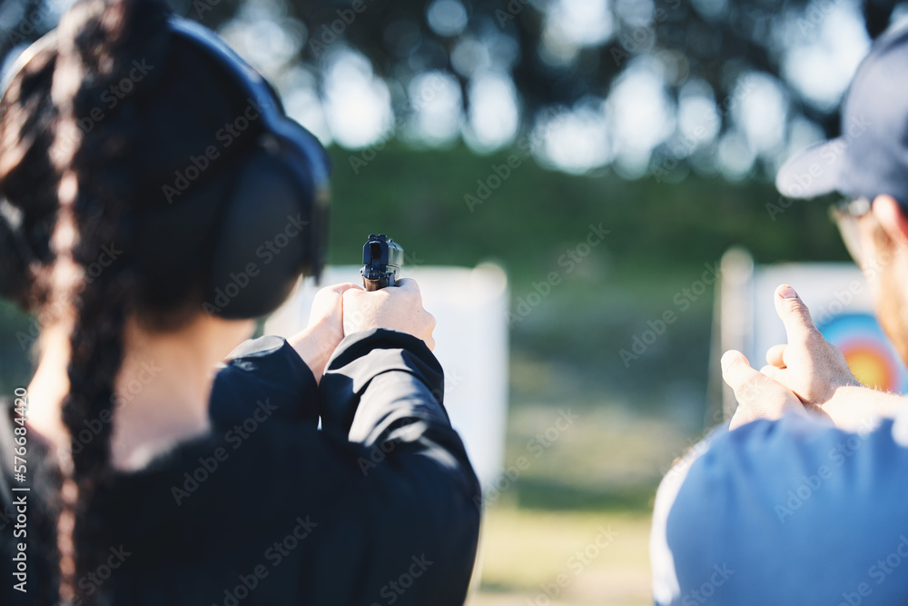 Woman, gun and learning to shoot outdoor with instructor at shooting range for target training. Safety and security with hand teaching person sport game or aim with gear and firearm for focus - obrazy, fototapety, plakaty 