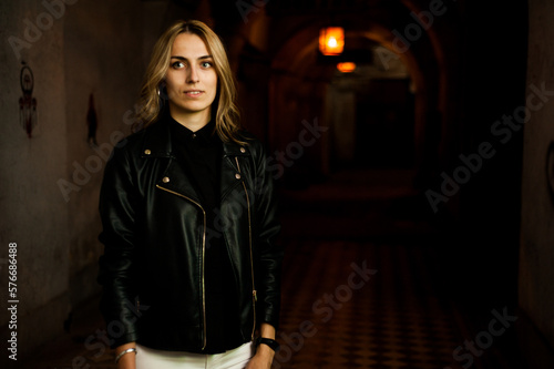 Woman wearing casual clothes walking in warm autumn evening city © alipko