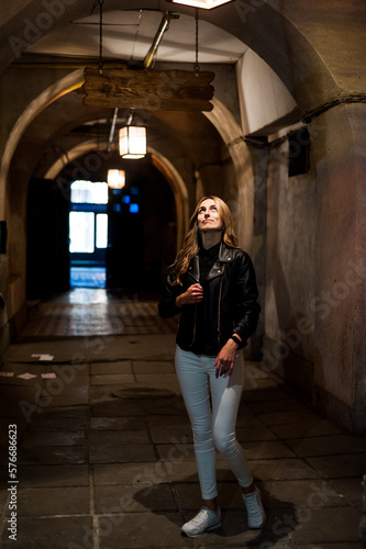 Portrait of beautiful woman in the evening with city light © alipko
