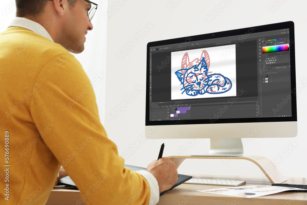 Animator working with graphic tablet and computer. Illustration on screen Animator working with graphic tablet and computer. Illustration on screen