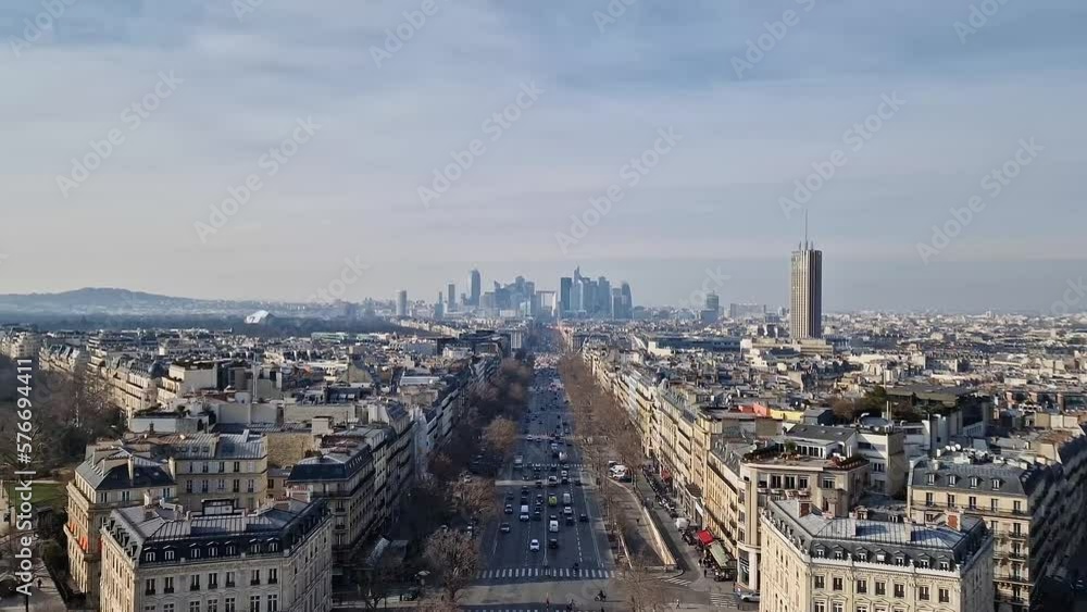 Aerial Paris cityscape with view to La Defense metropolitan district, France. Beautiful parisian architecture with historic buildings, landmarks and busy city streets with car traffic Aerial Paris cityscape with view to La Defense metropolitan district, France. Beautiful parisian architecture with historic buildings, landmarks and busy city streets with car traffic