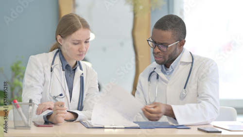 African Doctor and Female Doctor Working in Clinic