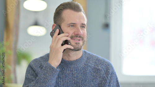 Middle Aged Man Talking on Phone