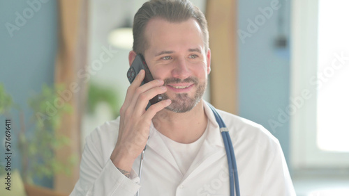 Portrait of Doctor Talking on Phone