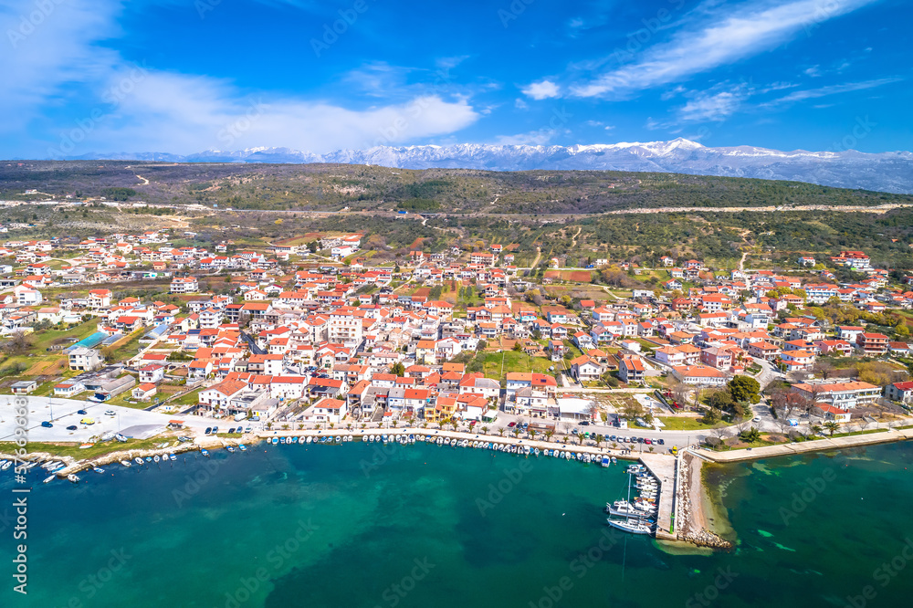 Coastal town of Posedarje waterfront and Velebit mountain aerial view