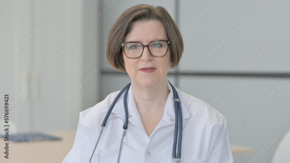 Senior Doctor Talking on Online Video Call Senior Doctor Talking on Online Video Call