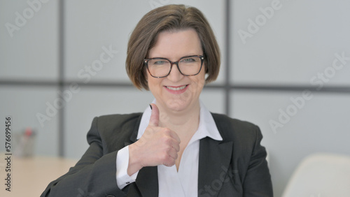 Portrait of Old Businesswoman showing Thumbs Up