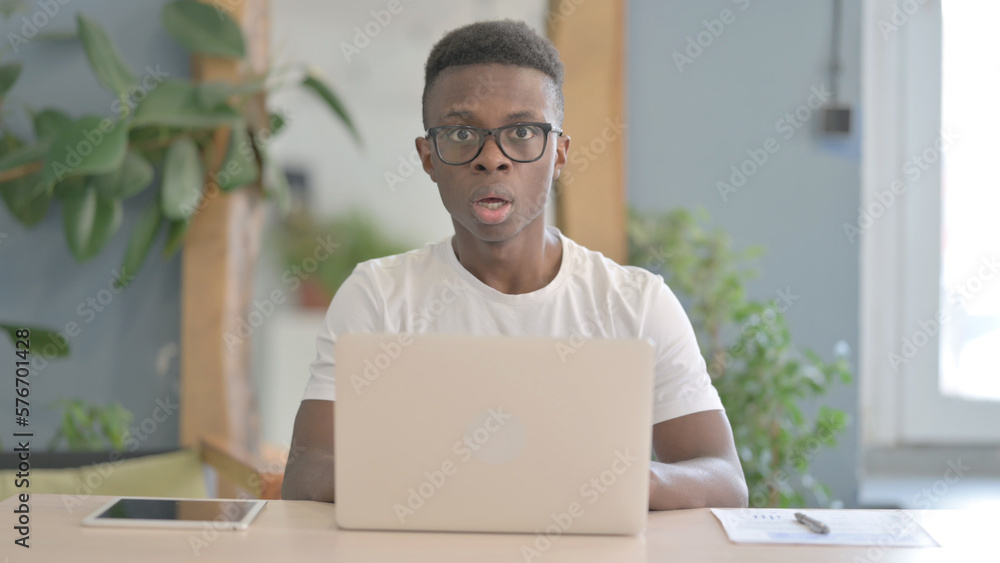 African Man Shocked While Working on Laptop African Man Shocked While Working on Laptop