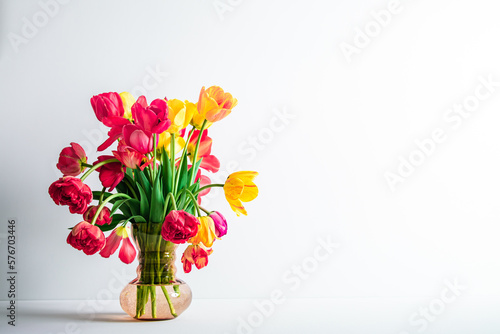 Wallpaper Mural Big flowers bouquet of multicolored tulips in vintage glass vase on white color background with copy space. Business card. Invitation postcard. Place for greeting text. International holiday. Banner Torontodigital.ca
