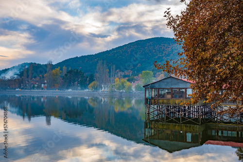 Different views of Golcuk Lake near to Izmir Province, beautiful reflection on water and colors of nature with clouds on blue sky