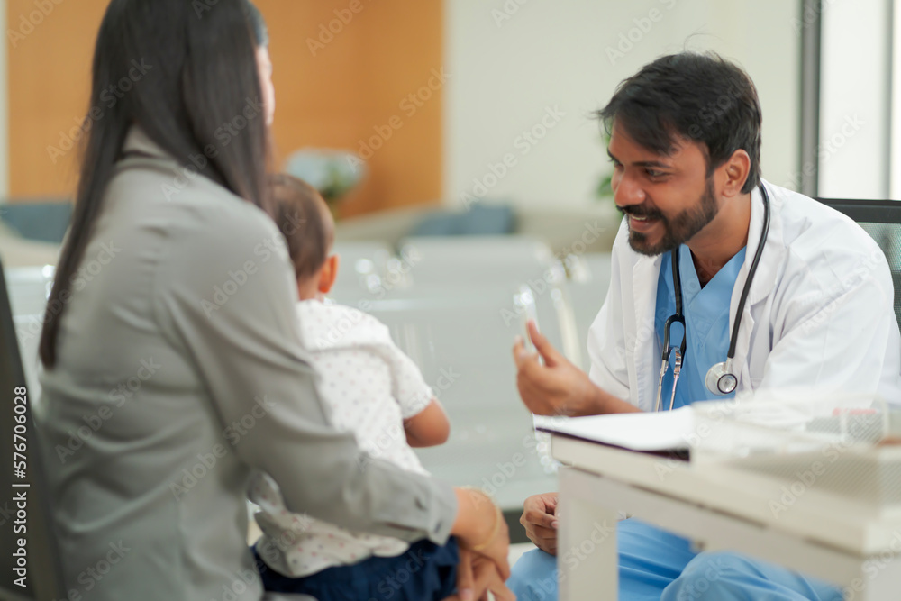 A kind doctor who treats pediatric patients. The child and his family brought him to see the doctor at the hospital because he was ill. A kind doctor who treats pediatric patients. The child and his family brought him to see the doctor at the hospital because he was ill.