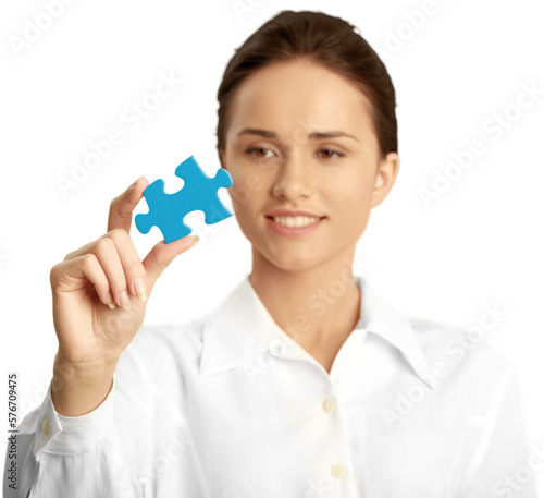 Female holding a puzzle piece