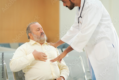 An elderly male patient with high body fat, obesity, sees a doctor at the hospital due to body problems because of a lot of weight.