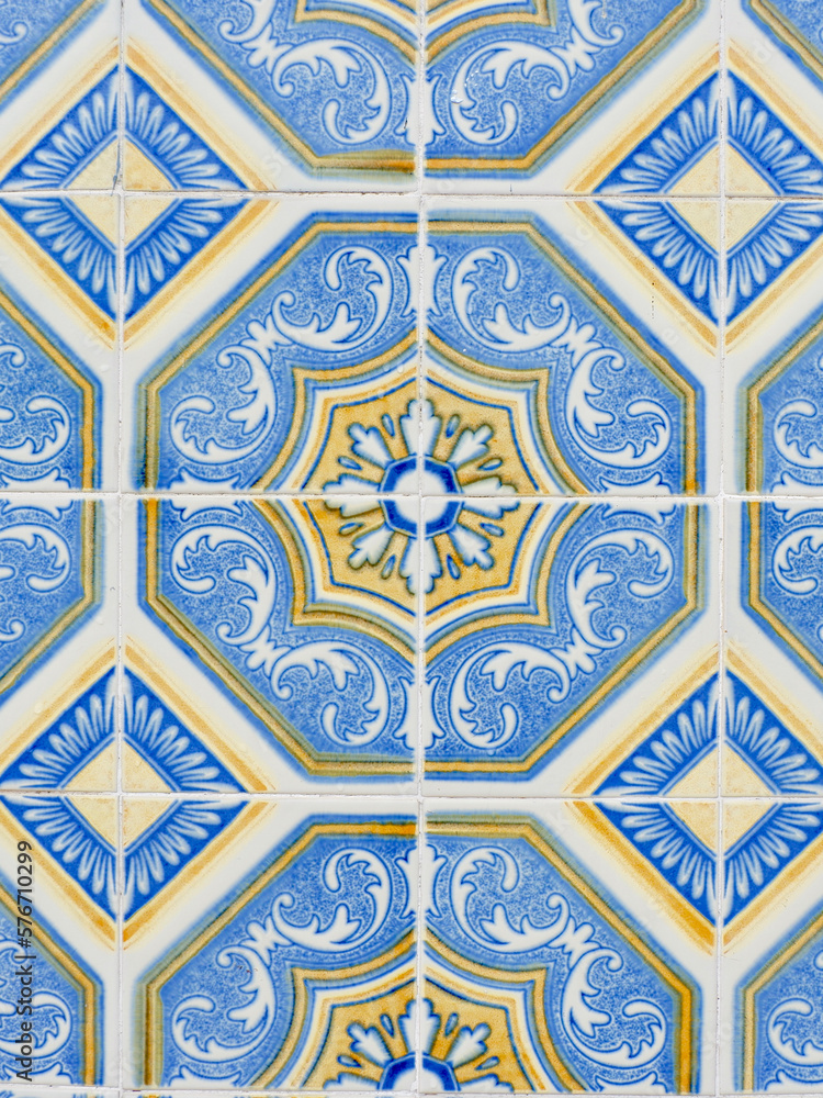 Traditional vintage tiles on the wall outside in downtown district in Porto, Portugal. Vertical photo