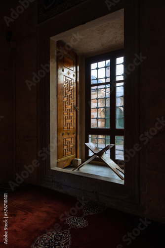 Islamic or ramadan concept photo. A lectern in front of a window of a mosque