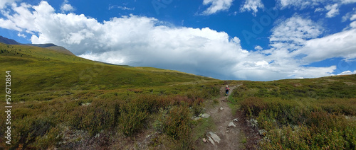 Lonely tourist goes on a high-mountainous plateau