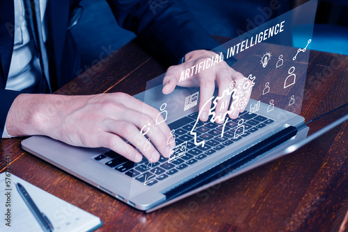 Businessmen Chat with Artificial Intelligence (AI) Chat BOT on a laptop, Man using technology smart robot AI, Futuristic technology transformation.