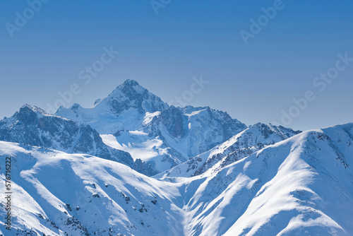 View of Nursultan Peak from a forest pass in winter near Almaty