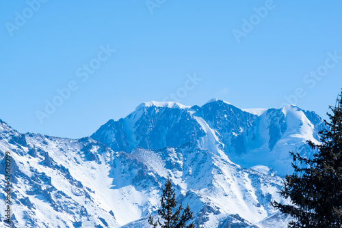 Panorama of Talgar Peak near Almaty. View of Talgar Peak from the forest pass in winter. © Сергей Дудиков