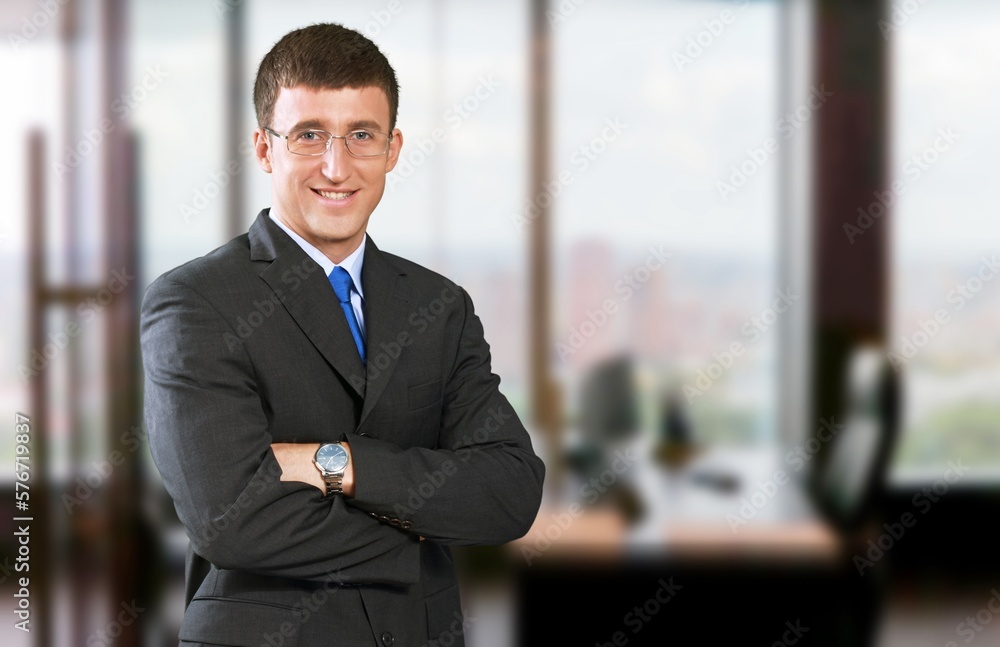 Smiling young business man employer in office Smiling young business man employer in office