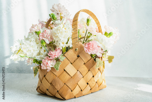 Beautiful straw bag with seasonal flowers
