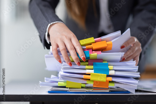 Business Documents, Auditor businesswoman checking searching document legal prepare paperwork or report for analysis TAX time,accountant Documents data contract partner deal in workplace office 