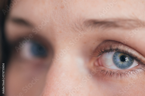 Closeup of woman blue eyes photo