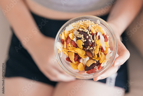 Anonymous woman eating healthy snack photo