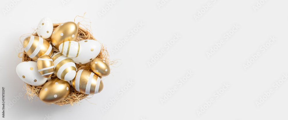 Bowl with Easter eggs on a white background