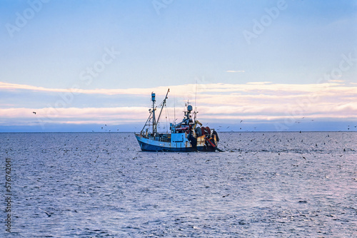 Schilderij op canvas Fishing boat trawling at sea