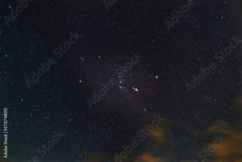 The Orion constellation with Nebula M42 and Barnards loop. The brilliant stars of the Orion the Hunter constellation, against dark night sky.