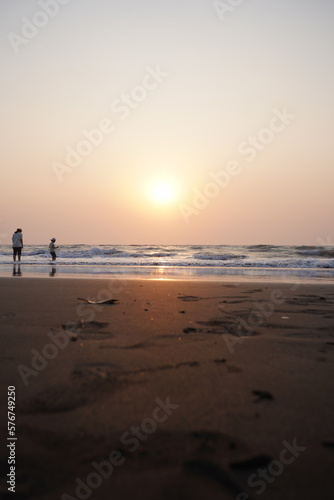 Vertical image of sunset on the beach