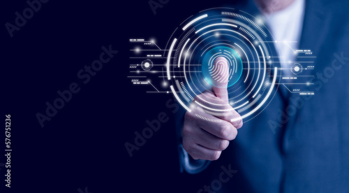 Businessman scans fingerprints on virtual screen. Cybersecurity concept, password user login, and fingerprint scan. , secure access to personal information, and secure Internet access.