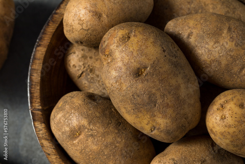 Raw Brown Organic Russet Potatoes photo