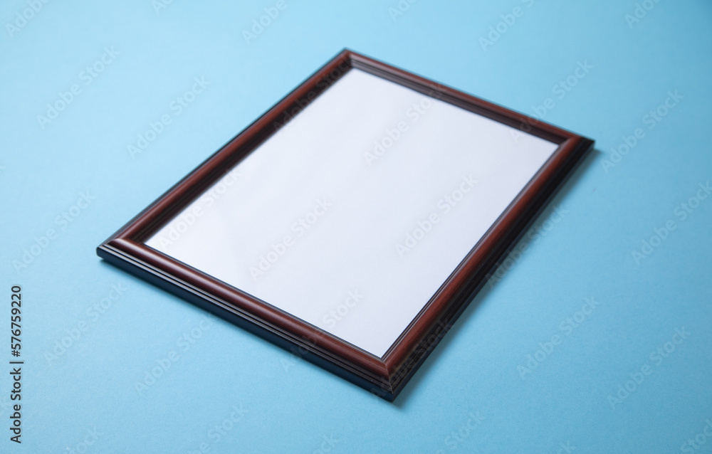 Empty diploma or certificate frame on the blue background. Empty diploma or certificate frame on the blue background.