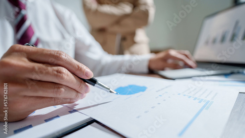 Business investor analyzing a valuation data forecast a investment project..