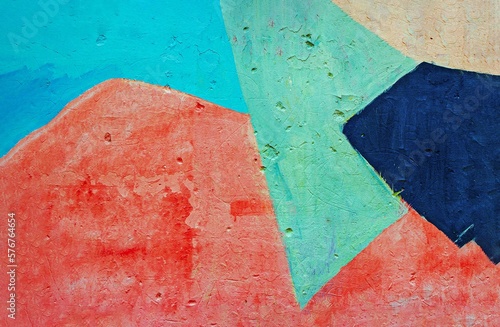 Abstract background of geometric shapes in red, yellow, blue, green, beige. The texture of a concrete wall. Copy space