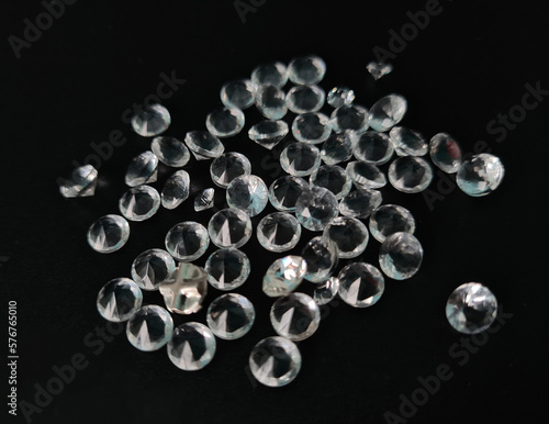 Diamond isolated on black background. Round brilliant cut © Nadzeya