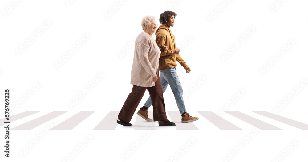 Young african american man helping a senior woman on a pedestiran crossing Young african american man helping a senior woman on a pedestiran crossing