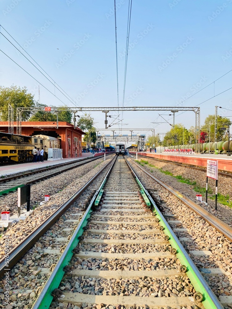 Indian people crossing railway track in mumbai

