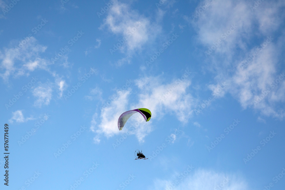 Paraglider. Flight against the background of the blue sky. Paraglider. Flight against the background of the blue sky.