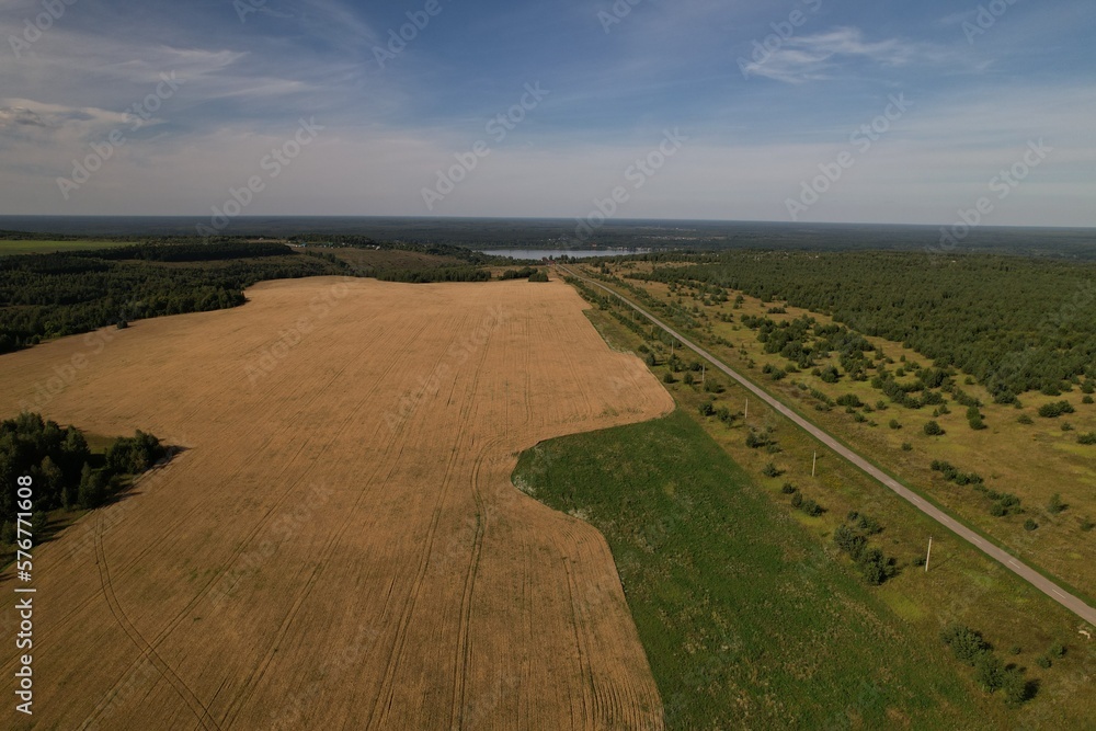 Field and road in Russian village from drone Field and road in Russian village from drone