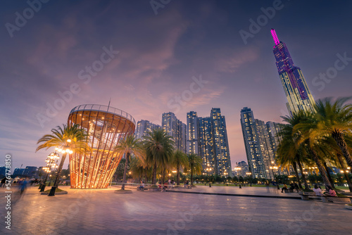 Beautiful night view with colorful sky at Landmark 81 - it is a super tall skyscraper with development buildings along Saigon river in Ho Chi Minh city, Vietnam. © CravenA